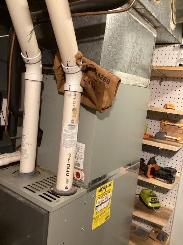 Responded to no cooling complaint on residential HVAC system. Upon arrival, documented existing equipment configuration including indoor air handler unit and outdoor condensing unit, both appearing to be 20+ years old based on visual inspection. Performed diagnostic assessment to identify cause of cooling failure and photographed equipment for service records and potential replacement recommendations due to age of system.