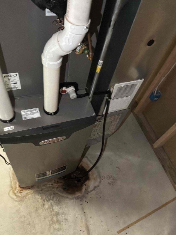 Conducted on-site estimate for complete HVAC system replacement of 22+ year old air conditioning unit that operated last season but has reached end of service life. Assessed existing Lennox furnace installation in basement with overhead air handler unit located in attic space, documented current system configuration including refrigerant lines, PVC condensate drainage, and ductwork connections. Provided replacement recommendations for aging equipment to ensure continued reliable heating and cooling performance.