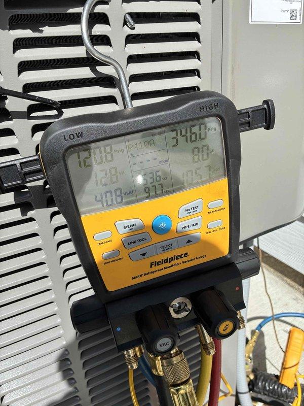 Completed air conditioning system startup and commissioning on residential HVAC unit. Utilized Fieldpiece SMAN digital manifold gauge to verify system pressures, temperatures, and refrigerant charge levels. All readings confirmed within manufacturer specifications, with system operating properly and unit ready for service.