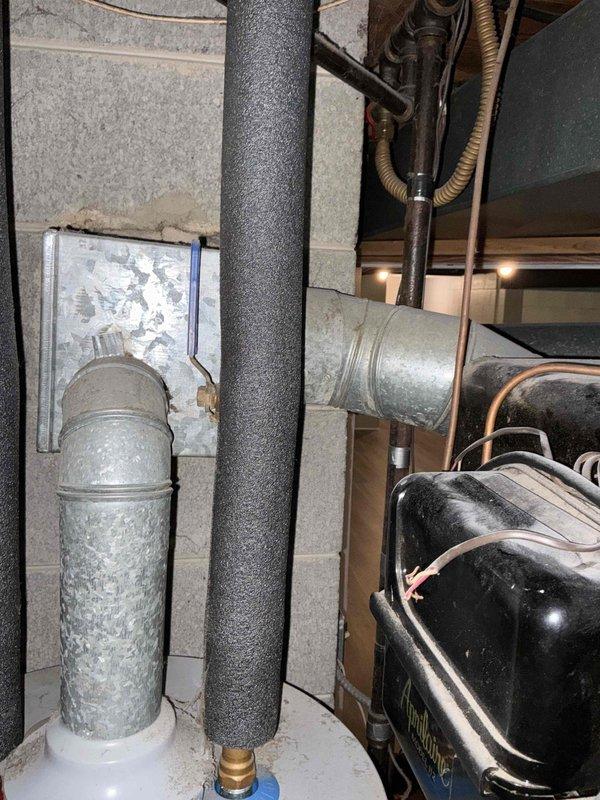 Conducted comprehensive estimate for complete HVAC system replacement including aging furnace and air conditioning unit located in basement mechanical room. Both units currently operational but have exceeded recommended service life and require replacement to ensure continued reliability and efficiency. Documented existing equipment configuration including outdoor condensing unit, refrigerant lines, ductwork connections, and basement furnace installation with supporting photography for proposal development.
