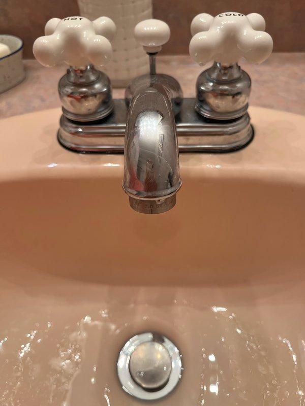 Completed installation of new sump pump in utility area to ensure proper water removal and basement flood prevention. Additionally, installed customer-supplied showerhead with flexible metal hose and mounted grab bars in bathroom to improve safety and accessibility.