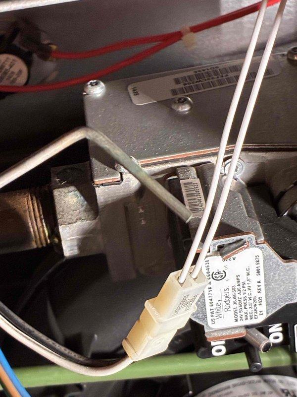 Completed comprehensive AC and furnace tune-up inspection. Identified deteriorated black refrigerant line set tubing penetrating exterior wall requiring replacement and noted missing caulking at wall penetration point that needs sealing to prevent air infiltration and moisture intrusion.