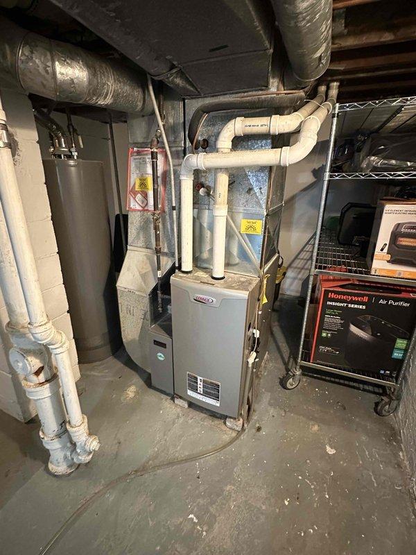 Completed estimate for replacement of 1988 air conditioning system. Evaluated existing outdoor condenser unit and indoor Lennox furnace in basement mechanical room, both showing age but currently operational. Discussed replacement options and financing programs with customer interested in upgrading aging HVAC equipment.