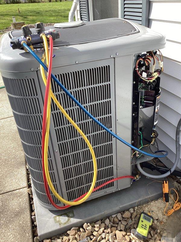 Completed comprehensive AC tune-up on Carrier system, including indoor furnace and outdoor condenser unit inspection. Performed standard maintenance procedures with refrigerant pressure testing using manifold gauges, electrical component verification, and system operational checks. All equipment found operating within normal parameters with no issues identified during service visit.