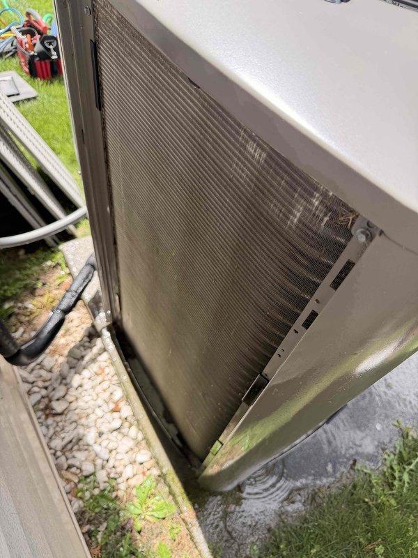 Completed scheduled bi-annual tune-up and preventive maintenance on residential outdoor condensing unit. Performed comprehensive system inspection including visual assessment of condenser coil condition, electrical connections, and unit placement. Conducted electrical diagnostics using clamp meter to verify proper amperage draw and system performance, with readings indicating normal operating parameters at 0.15 amps during testing phase. Unit operational and functioning within manufacturer specifications upon completion of service.