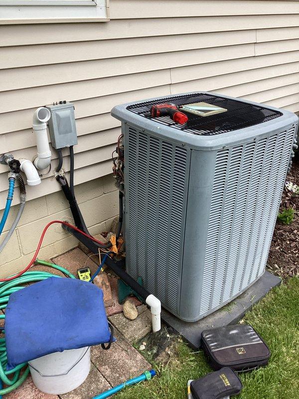 Completed annual tune-up on residential air conditioning system. Connected manifold gauge set to measure refrigerant pressures and verify system operation within manufacturer specifications. All refrigerant levels confirmed adequate, unit cycling properly with no leaks detected.
