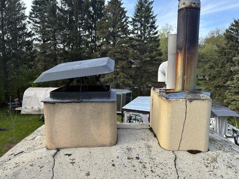 Conducted on-site estimate for replacement of 13-year-old two-stage furnace and air conditioning system located in basement. Performed visual inspection of existing HVAC equipment and assessed rooftop venting infrastructure, noting aged metal flue pipe with significant rust and corrosion requiring replacement during system upgrade.
