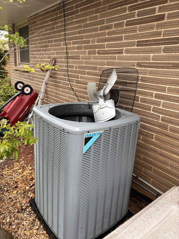 Completed routine cooling system maintenance visit as part of membership agreement. Performed comprehensive inspection of outdoor condensing unit, which showed significant accumulation of leaves, twigs, and organic debris in the base pan and around compressor components. Cleaned debris from unit interior, inspected compressor, capacitor, refrigerant lines, and electrical connections, and verified all components were operating within normal parameters.
