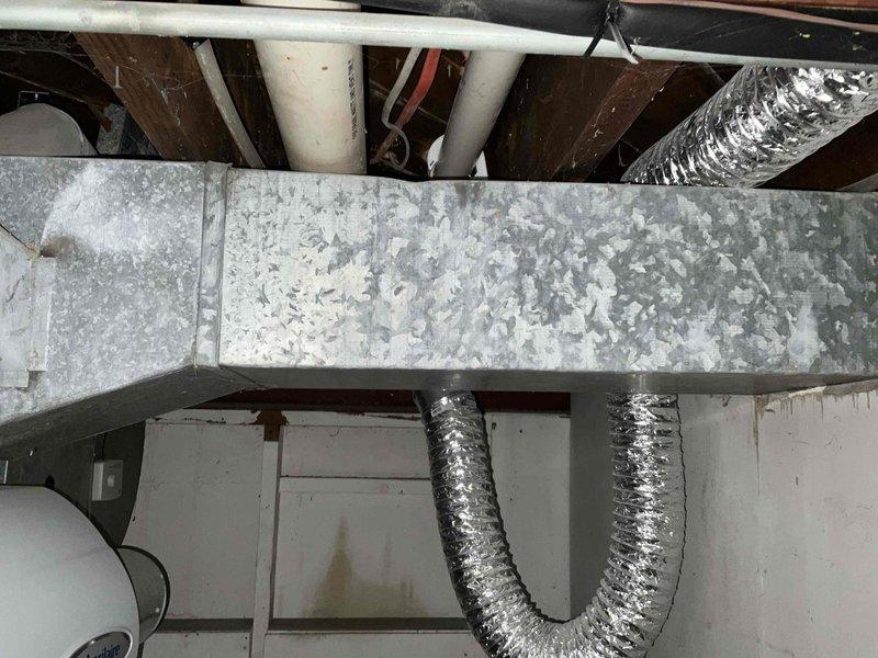 Conducted on-site assessment for mini split system installation in residential property. Evaluated existing HVAC infrastructure in basement utility area, documenting current ductwork configuration, mechanical components, and available mounting locations for indoor and outdoor units. Photographed installation area to determine optimal equipment placement and identify any potential obstacles for refrigerant line routing and electrical connections.