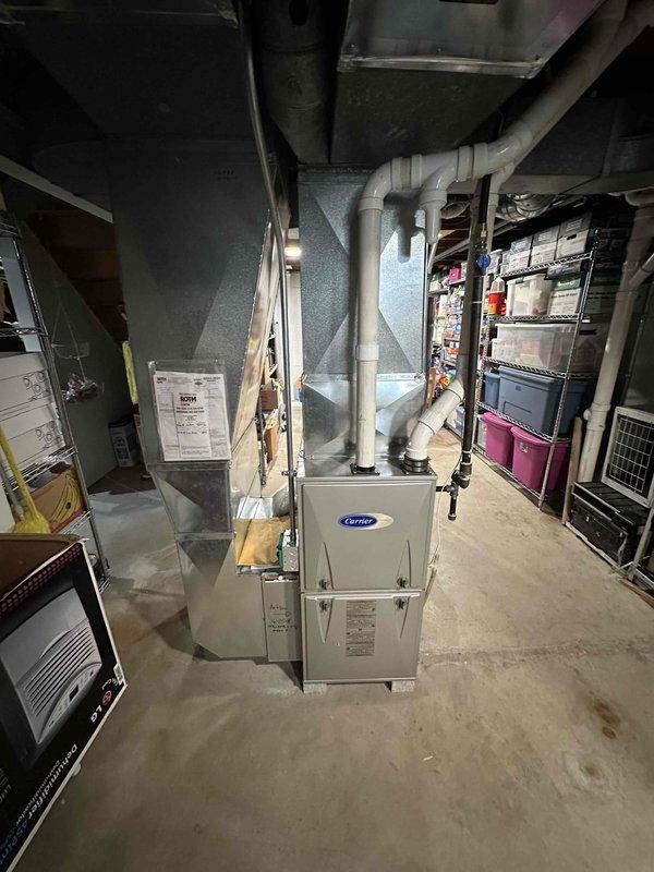 Conducted estimate for air conditioning system addition to existing home with Carrier gas furnace currently installed in basement. Assessed installation requirements, reviewed existing ductwork infrastructure and determined optimal placement for outdoor condensing unit on exterior side of home near foundation with PVC condensate drainage routing. Documented existing furnace configuration, available electrical service, and recommended AC unit positioning to integrate with current heating system for complete HVAC functionality.