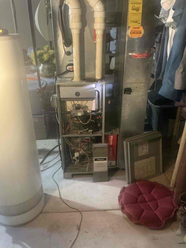 Conducted estimate for complete HVAC system replacement in basement installation. Existing furnace (80,000 BTU natural gas unit) is non-operational and requires replacement along with air conditioning system. Assessed current equipment configuration, measured installation area, and documented existing ductwork layout including supply and return air pathways. Provided estimate for new furnace and AC system with promotional offer including complimentary water heater replacement. Documented equipment specifications, clearance requirements, and necessary modifications for proper installation.