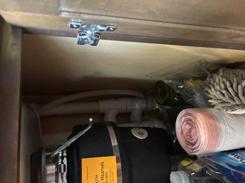 Performed on-site assessment for kitchen sink and faucet replacement estimate. Inspected existing undermount stainless steel sink installation, evaluated under-cabinet plumbing configuration including supply lines and drainage system, and documented current fixture conditions. Assessed countertop penetrations and cabinet space constraints for new fixture installation, and evaluated ventilation requirements for countertop application as requested.