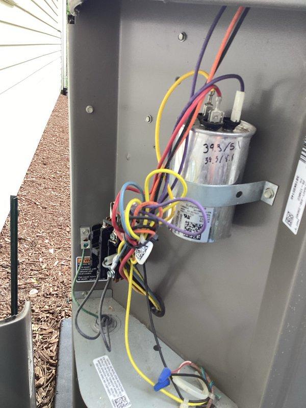 Responded to service call for reported leak in furnace piping previously identified by utility company. Performed diagnostic inspection of HVAC system including electrical testing with digital multimeter and thorough examination of outdoor condensing unit components. Inspected capacitor, contactor assembly, and associated wiring connections to assess overall system condition during tune-up service.