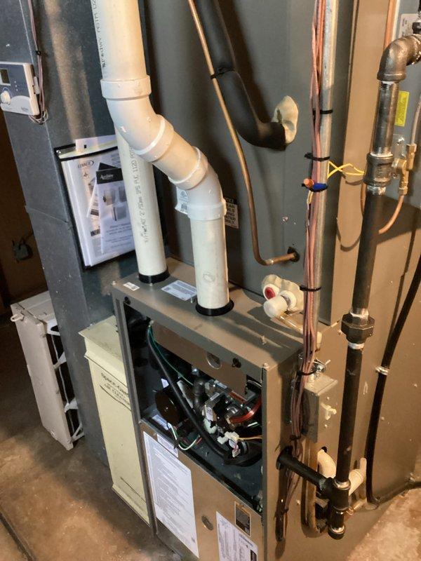 Completed routine cooling system maintenance visit as part of prepaid membership agreement. Performed comprehensive system diagnostics using Yellow Jacket R-410A manifold gauge set to verify refrigerant pressures and system operating parameters. Inspected residential HVAC equipment including furnace unit, associated PVC venting and condensate drainage systems, copper refrigerant lines, and electrical connections. All components found operating within normal specifications with no deficiencies noted. System tested and confirmed ready for continued cooling season operation.