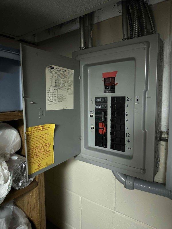 Conducted estimate for replacement of existing attic-mounted air handler unit. Inspected current equipment and attic installation conditions, documenting electrical panel configuration with main disconnect and circuit breaker arrangement, as well as existing ductwork layout including black flexible ducts and silver reflective insulation materials. Provided mid-range equipment replacement options to meet customer requirements for reliable performance without premium-tier pricing.