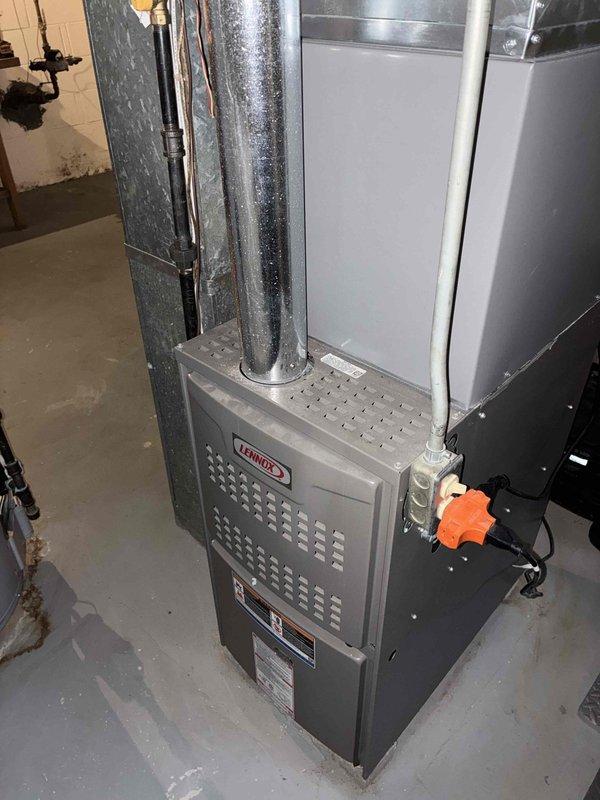 Completed air conditioning tune-up at new property with Lennox HVAC system. Performed standard maintenance inspection of indoor furnace unit and outdoor condenser coil, documented equipment information, and noted outdoor coil requires cleaning due to heavy dirt and debris accumulation restricting airflow through fins.