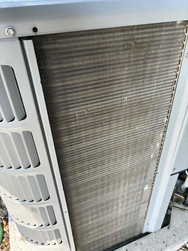 Completed air conditioning tune-up at new property with Lennox HVAC system. Performed standard maintenance inspection of indoor furnace unit and outdoor condenser coil, documented equipment information, and noted outdoor coil requires cleaning due to heavy dirt and debris accumulation restricting airflow through fins.