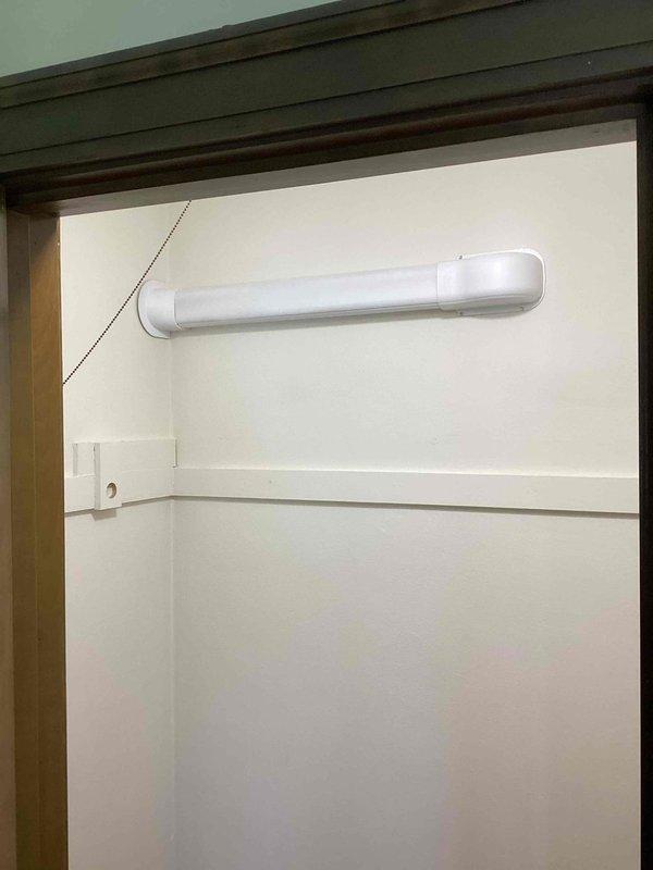 Completed mini-split system installation at residential property. Installed outdoor condenser unit on exterior brick wall with proper refrigerant line set routing and drainage system using white PVC piping. Mounted indoor air handler unit in interior closet space with electrical connections, verified proper operation of all components, and conducted system testing to ensure optimal performance.