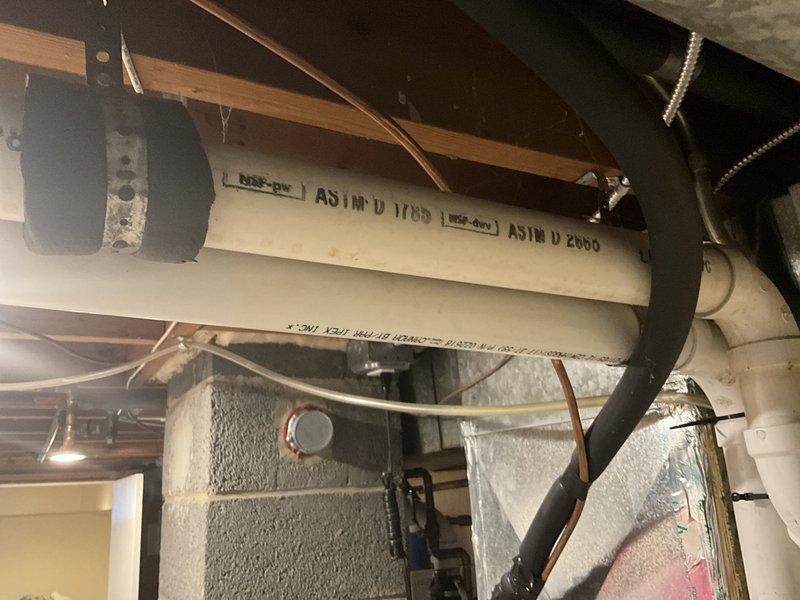Completed on-site estimate for dual zone heat pump replacement system. Assessed existing HVAC infrastructure including ductwork, refrigerant lines, and electrical connections in basement utility area to determine installation requirements and compatibility for new equipment.
