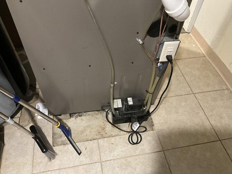 Completed on-site estimate for dual zone heat pump replacement system. Assessed existing HVAC infrastructure including ductwork, refrigerant lines, and electrical connections in basement utility area to determine installation requirements and compatibility for new equipment.