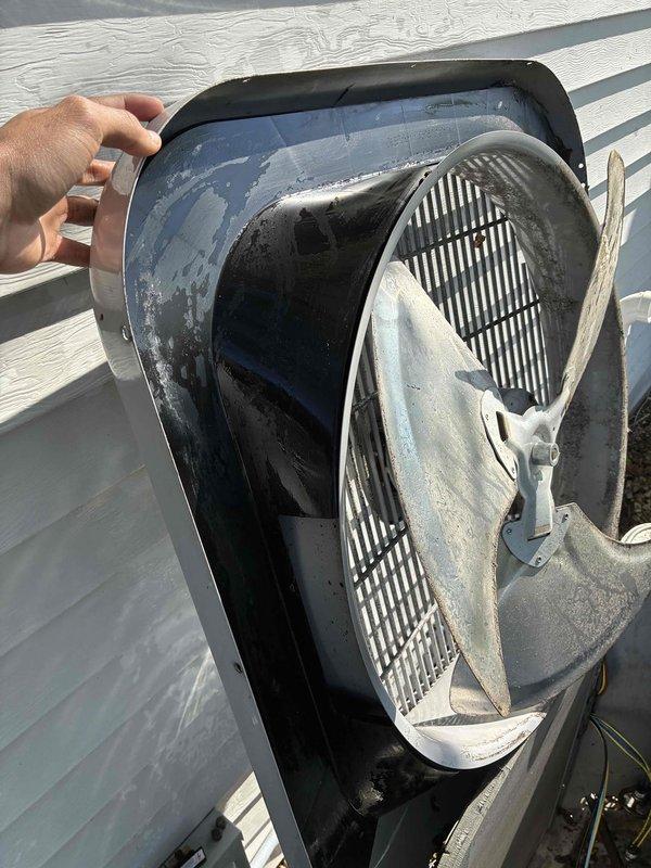 Completed air conditioning tune-up on rooftop HVAC unit. Opened and inspected both rooftop unit and ground-level condenser, finding moderate dirt and debris accumulation on fan assemblies and internal components. Cleaned fan blades, housing, and compressor area, removing outdoor debris and grime buildup from all accessible surfaces.