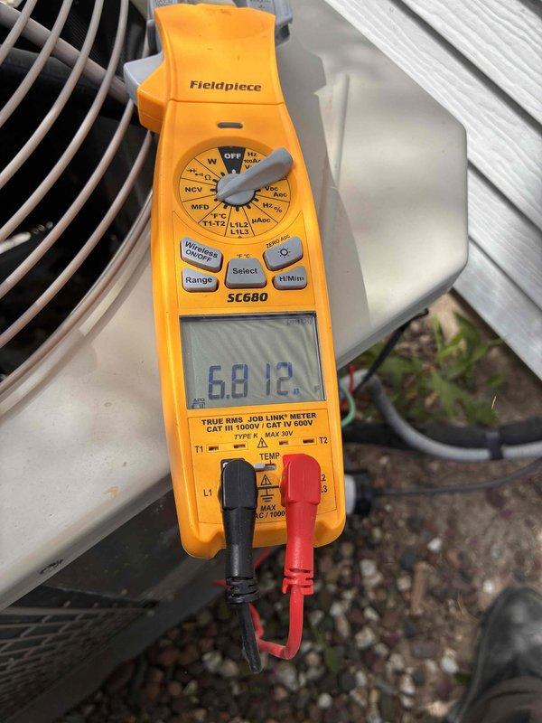 Performed routine maintenance and tune-up on residential air conditioning system. Conducted electrical diagnostics using digital multimeter, verifying proper voltage and capacitance readings on outdoor condensing unit. Inspected evaporator coil assembly and blower motor, noting moderate corrosion and staining on drain pan that will require monitoring for potential future replacement.
