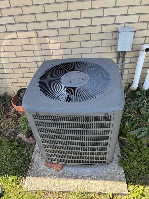 Responded to service call for air conditioning unit producing clunking noise during operation. Upon arrival, inspected outdoor condenser unit and surrounding components, documented equipment condition with photographs showing unit properly positioned on concrete pad with adequate clearance and access to refrigerant lines and electrical connections. Conducted operational assessment to identify source of mechanical noise and verified system functionality.