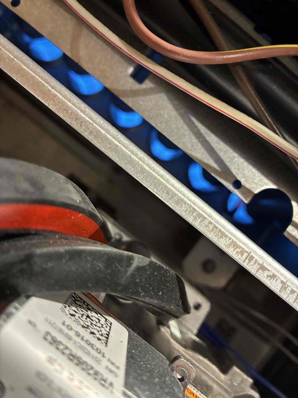Responded to service call for corroded and leaking air filter assembly with continuous operation issue. Upon arrival, found the unit experiencing repeat failure after recent tune-up service. Inspected humidification control system and verified settings were configured to "Humidify" mode with basic control center parameters. Assessed water leak source at filter housing, documented corroded components, and examined system wiring and refrigerant line connections for proper installation and potential water damage.