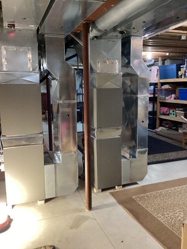 Completed dual furnace replacement in residential basement mechanical room. Installed two new furnace units with associated ductwork, copper refrigerant lines, and PVC condensate drainage systems. All equipment properly mounted, leveled, and secured with manufacturer specifications met for clearances and ventilation requirements.