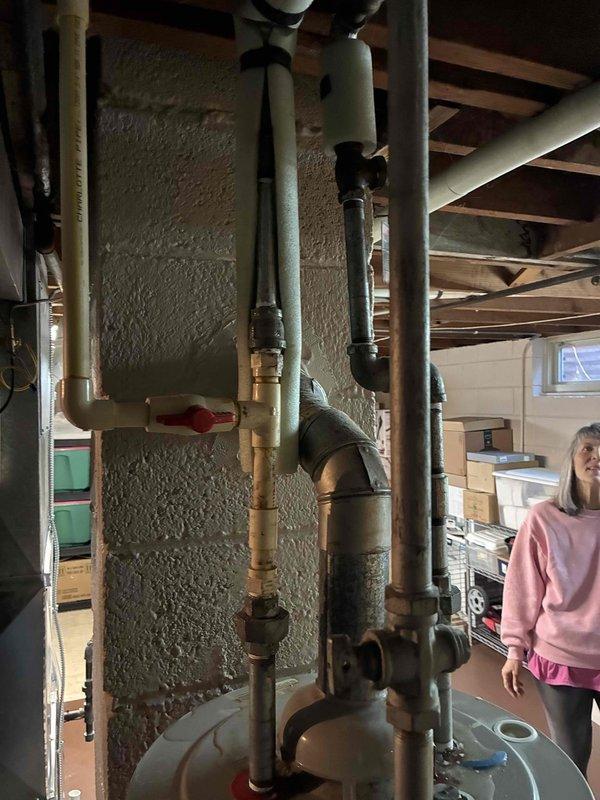 Conducted estimate for replacement of existing 50-gallon residential water heater experiencing active leak. Assessed basement installation location, documented current unit dimensions and plumbing configuration, and evaluated mechanical clearances and venting requirements for replacement equipment. Provided homeowner with replacement options and specifications for new A.O. Smith water heater installation.