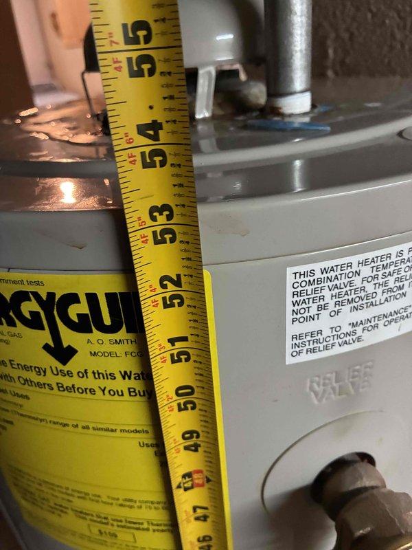 Conducted estimate for replacement of existing 50-gallon residential water heater experiencing active leak. Assessed basement installation location, documented current unit dimensions and plumbing configuration, and evaluated mechanical clearances and venting requirements for replacement equipment. Provided homeowner with replacement options and specifications for new A.O. Smith water heater installation.