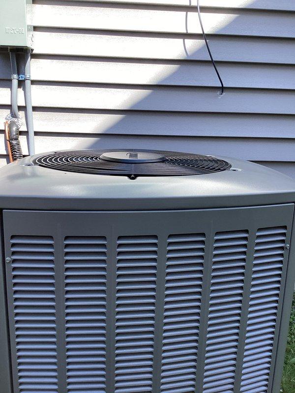 Completed full HVAC system installation including new air conditioning condenser unit and furnace. Installed outdoor condensing unit on concrete pad with proper clearances from structure, mounted Eaton electrical disconnect box to exterior wall, and ran gray PVC conduit for electrical connections. Routed refrigerant line sets with insulation between outdoor and indoor units. System was pressure tested, evacuated, and charged to manufacturer specifications. All electrical connections completed per code requirements, unit tested and confirmed operational with proper airflow and cycling.