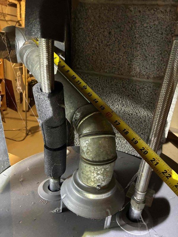 Responded to service call for water heater failure with active leak from bottom of tank. Upon inspection, found 40-gallon natural gas water heater (manufactured February 2018) with severe corrosion on tank bottom and connecting components, including significant oxidation on metallic fittings and elbow joints showing greenish-gray patina from prolonged moisture exposure. Unit deemed non-repairable due to tank integrity compromise. Provided comprehensive estimate for complete water heater replacement including removal of failed unit, installation of new comparable natural gas water heater with proper venting and code-compliant connections, and disposal of old equipment.