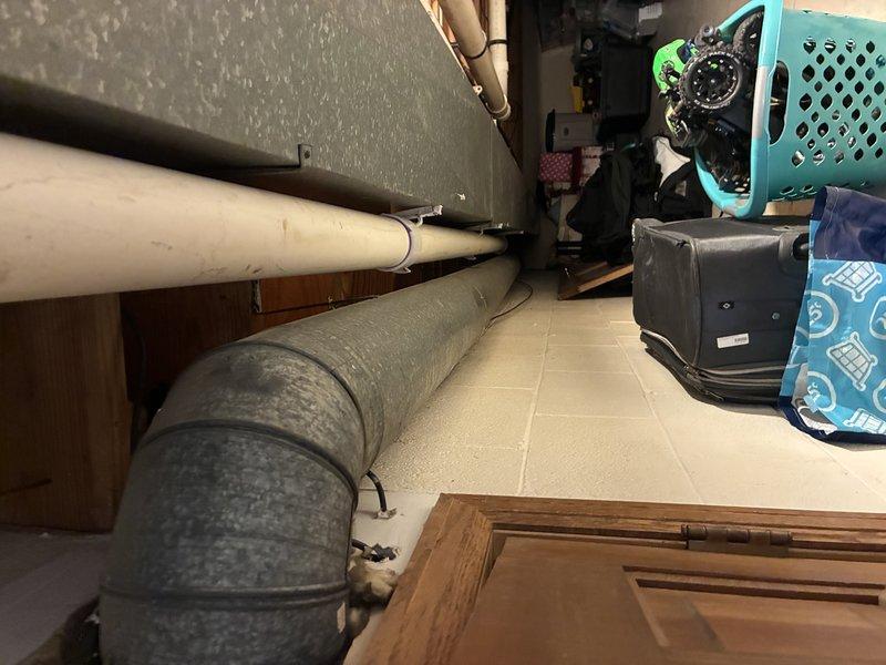 Conducted on-site assessment for water heater replacement in residential property. Customer currently has 50-gallon conventional tank unit but requires increased hot water capacity. Evaluated existing installation location in basement utility area and discussed options including power vent models and tankless water heater systems to meet expanded household demand. Documented existing plumbing configuration, venting pathways, and utility connections. Provided recommendations for upgraded capacity solutions based on household requirements and available installation space.