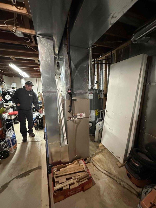Provided estimate for replacement of existing Carrier Infinity air conditioning system due to leak in evaporator coil. Documented existing equipment model and serial numbers via thermostat interface and assessed current furnace and ductwork configuration in mechanical room for compatibility with new system installation.