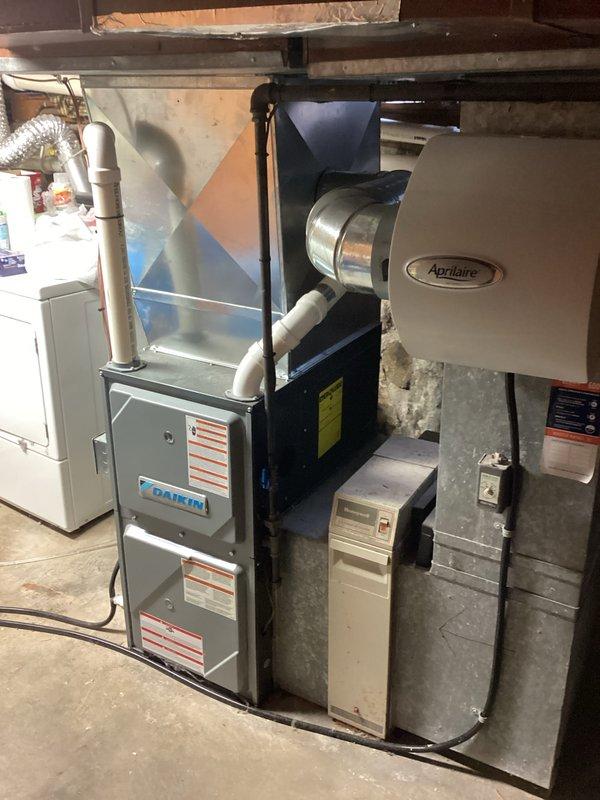 Completed annual A/C tune-up on Lennox condensing unit and Daikin furnace system. Performed standard maintenance including system inspection, cleaning of outdoor unit showing dirt accumulation on panels, verification of proper operation of all components, and assessment of Aprilaire humidifier integration with ductwork. All equipment found to be operational with no immediate repairs required.