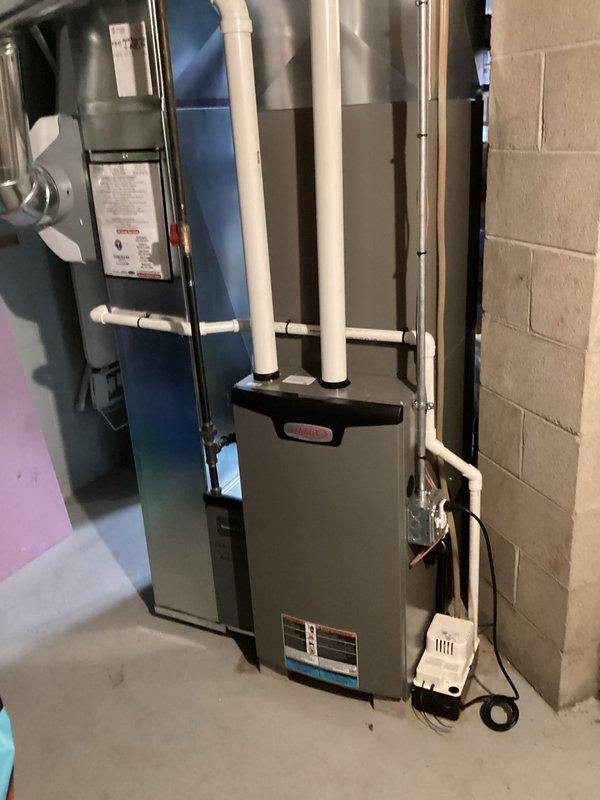 Completed routine cooling system maintenance visit as part of membership agreement. Performed comprehensive inspection of dual HVAC system installation, including air handler and furnace units with PVC venting. Utilized manifold gauge set to check refrigerant pressures and verify system operating within manufacturer specifications.