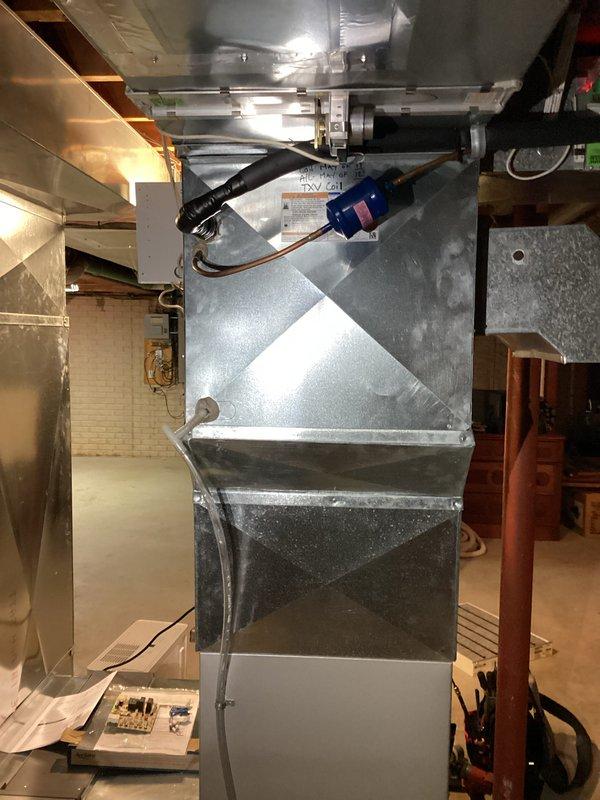 Completed air conditioning and furnace tune-up on residential HVAC system. Performed standard maintenance procedures including pressure testing with manifold gauges on outdoor condenser unit and inspection of indoor air handler in basement mechanical room. System requires PGAPXCAR2025-AD2 filter replacement, sized 10x12.