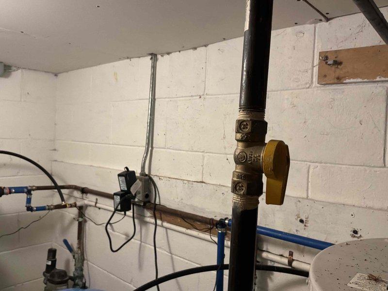 Completed estimate for water heater replacement in residential basement utility room. Assessed existing water heater installation, connections, and surrounding plumbing infrastructure including pressure tank and water softening system. Documented current equipment configuration with copper supply lines, shutoff valves, and drainage connections. Coordinated installation scheduling to accommodate customer availability, with arrangements made for authorized representative to be present during replacement. Confirmed 12-1 arrival window and established communication protocol for day-of-service contact.