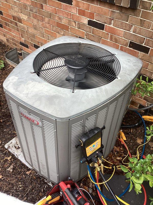 Completed routine cooling system maintenance visit as part of recurring membership agreement. Connected manifold gauges to outdoor condensing unit to verify refrigerant pressures and system performance. Inspected condenser coil condition, noting debris accumulation at base of unit and dirt buildup on exterior fins, and evaluated fan motor operation and overall equipment functionality.