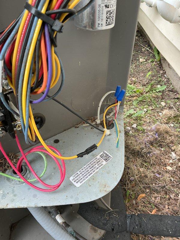 Completed membership cooling system tune-up and preventive maintenance inspection. Upon opening outdoor unit electrical compartment, discovered active bird's nest constructed with grass, twigs, and plant material accumulated around contactors, terminal blocks, and control wiring. Safely removed all nesting debris from enclosure to eliminate fire hazard and prevent equipment damage. Inspected all electrical connections, wire terminals, and control components for proper operation following debris removal. Verified system functionality and confirmed unit operating within normal parameters.