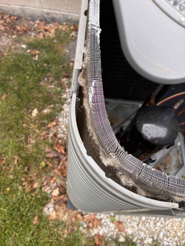 Completed prepaid membership cooling maintenance visit on residential HVAC system. Performed comprehensive inspection of outdoor condensing unit, revealing significant accumulation of dirt, dust, and debris on condenser coil fins and between fin spaces. Conducted electrical diagnostics using digital multimeter, obtaining capacitor reading of 499.1 MFD to verify proper system operation. Assessed condition of fan motor assembly, wiring connections, and internal components. Documented heavy debris buildup on cooling fins that may impact system efficiency and recommended cleaning to maintain optimal performance. All electrical measurements within acceptable parameters. System operational upon completion of inspection.