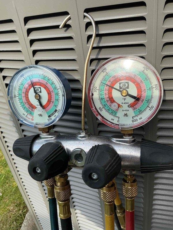 Completed comprehensive tune-up service on residential furnace and air conditioning system. Performed refrigerant pressure testing on the AC unit using manifold gauges, confirming proper R-404A refrigerant levels and system operation. Inspected furnace interior components including blower motor assembly, electrical connections, capacitor, and wiring harnesses to ensure all systems are functioning safely and efficiently for the upcoming season.