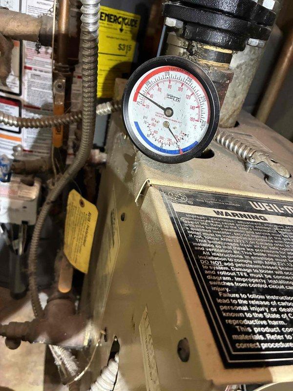 Completed recurring membership heating maintenance visit on Weil-McLain gas boiler system. Performed standard inspection of boiler unit, verified pressure gauge readings, and inspected all copper piping, flexible connectors, and valve assemblies for proper operation. Reconfigured thermostat settings to control heating only, as air conditioning system has been removed and will not be replaced.