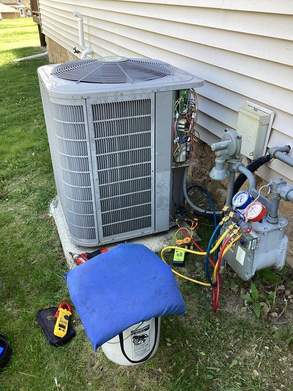 Completed scheduled prepaid membership cooling maintenance visit on residential air conditioning system. Performed comprehensive system diagnostics using Yellow Jacket Titan 4-valve manifold gauge set to measure refrigerant pressures and verify proper system operation. Accessed condenser unit electrical compartment to inspect internal components, wiring connections, and control board for signs of wear or damage. Utilized digital multimeter to test electrical values and ensure proper voltage supply to unit. All refrigerant pressures measured within manufacturer specifications, electrical components functioning normally, and system operating efficiently with no deficiencies noted.