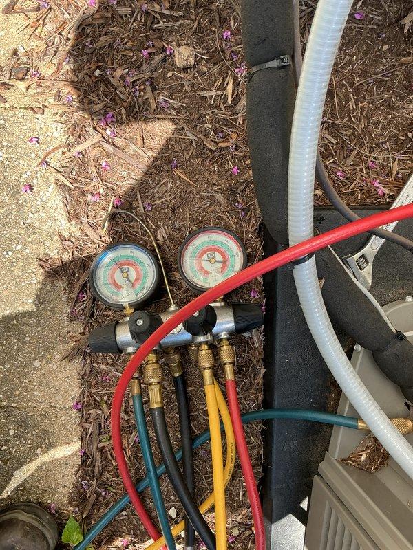 Completed air conditioning tune-up and system performance evaluation. Connected manifold gauges to measure refrigerant pressures and verify proper system operation. Inspected Lennox furnace unit, checked electrical connections, and confirmed all safety labels and components were in proper working order.