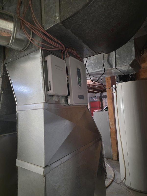 Completed installation of HVAC zoning system in basement mechanical room. Installed zone control panels with digital displays and integrated new ductwork with existing air handler system. Configured damper controls and verified proper operation of all zones to provide independent temperature control for multiple areas of the building.