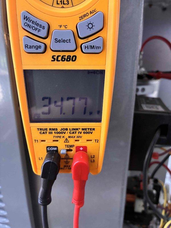Completed routine cooling system maintenance as part of recurring membership agreement. Performed diagnostic testing with digital multimeter showing system readings, inspected indoor air handler components including blower assembly and electrical connections, and observed outdoor condensing unit with significant debris accumulation requiring attention. Unit operational with capacitor and refrigerant lines intact, though outdoor coil cleaning recommended to maintain optimal efficiency.