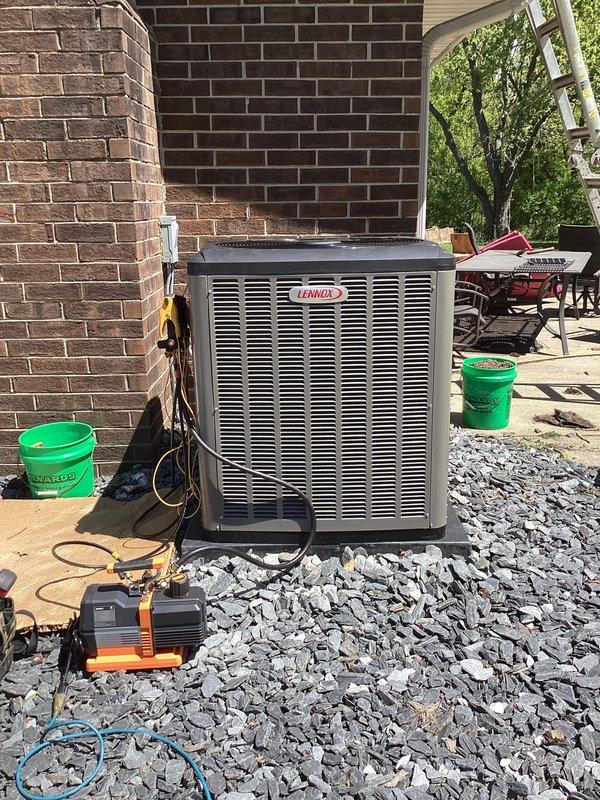 # Complete HVAC System Installation

Completed full residential HVAC system replacement including new furnace, air conditioning unit, and 40-gallon water heater. Installed Lennox outdoor condensing unit on gravel pad with proper clearances from structure. Routed copper refrigerant lines along exterior brick wall using secure mounting brackets and installed electrical disconnect box per code requirements.

Modified venting system by installing new PVC exhaust piping routed through existing chimney chase. Integrated SecureAir filtration system and S40 thermostat for enhanced air quality control and system management. Installed AA700 accessory package to complement system performance.

Coordinated with licensed electrician for all electrical connections and service upgrades. Obtained all required permits prior to installation. Verified proper refrigerant charge, tested all safety controls, and confirmed system operation across all heating and cooling modes. All equipment installed per man