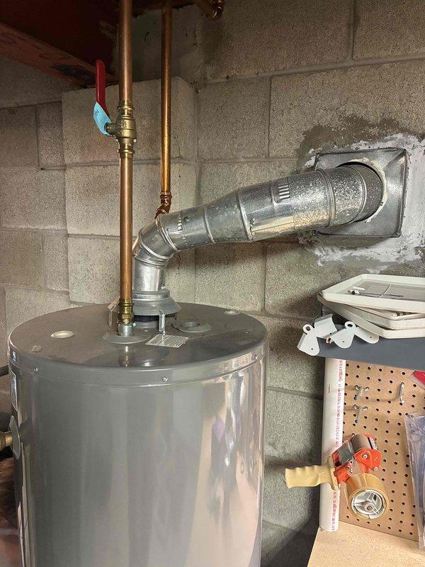 Conducted on-site assessment of leaking 50-gallon gas water heater in basement utility area. Provided detailed estimate for complete water heater replacement, including removal of existing Rheem unit, installation of new 50-gallon gas water heater with proper venting through existing flue system, and connection to existing copper supply lines and gas piping with code-compliant fittings and pressure relief valve.